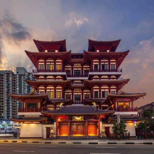 large chinese style building in front of modern buildings