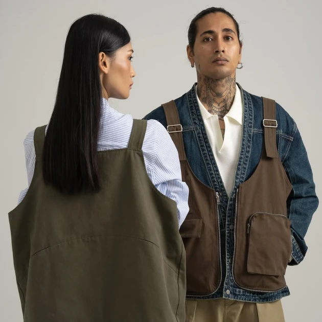 a man and woman modelling a brown vest