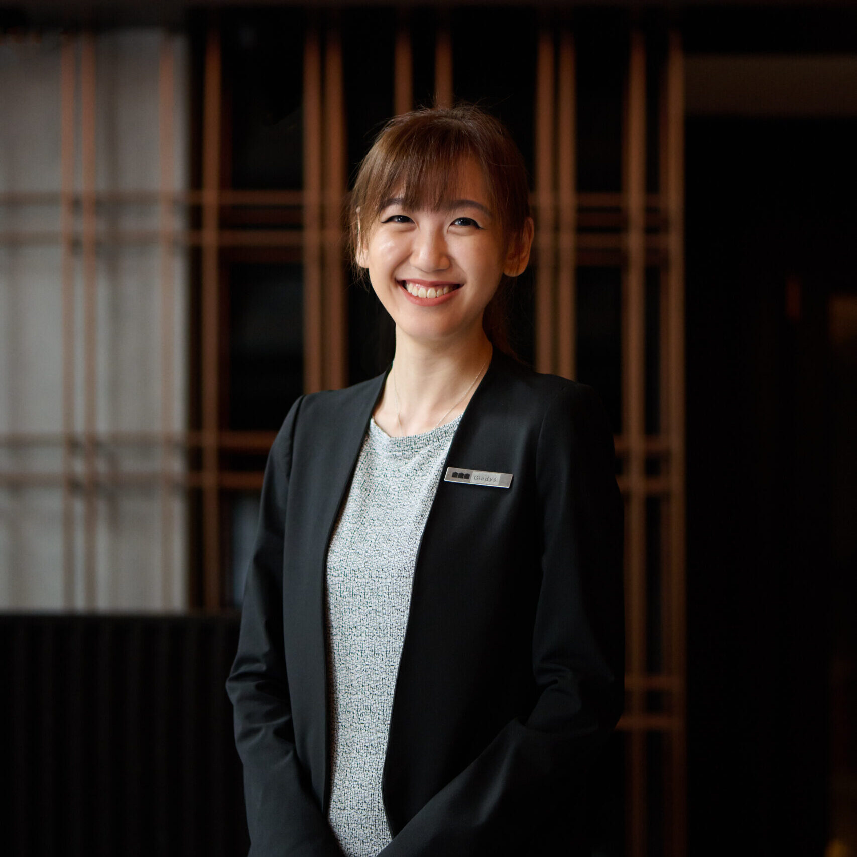 HIRES GLADYS 482 woman in a black blazer smiling to the camera