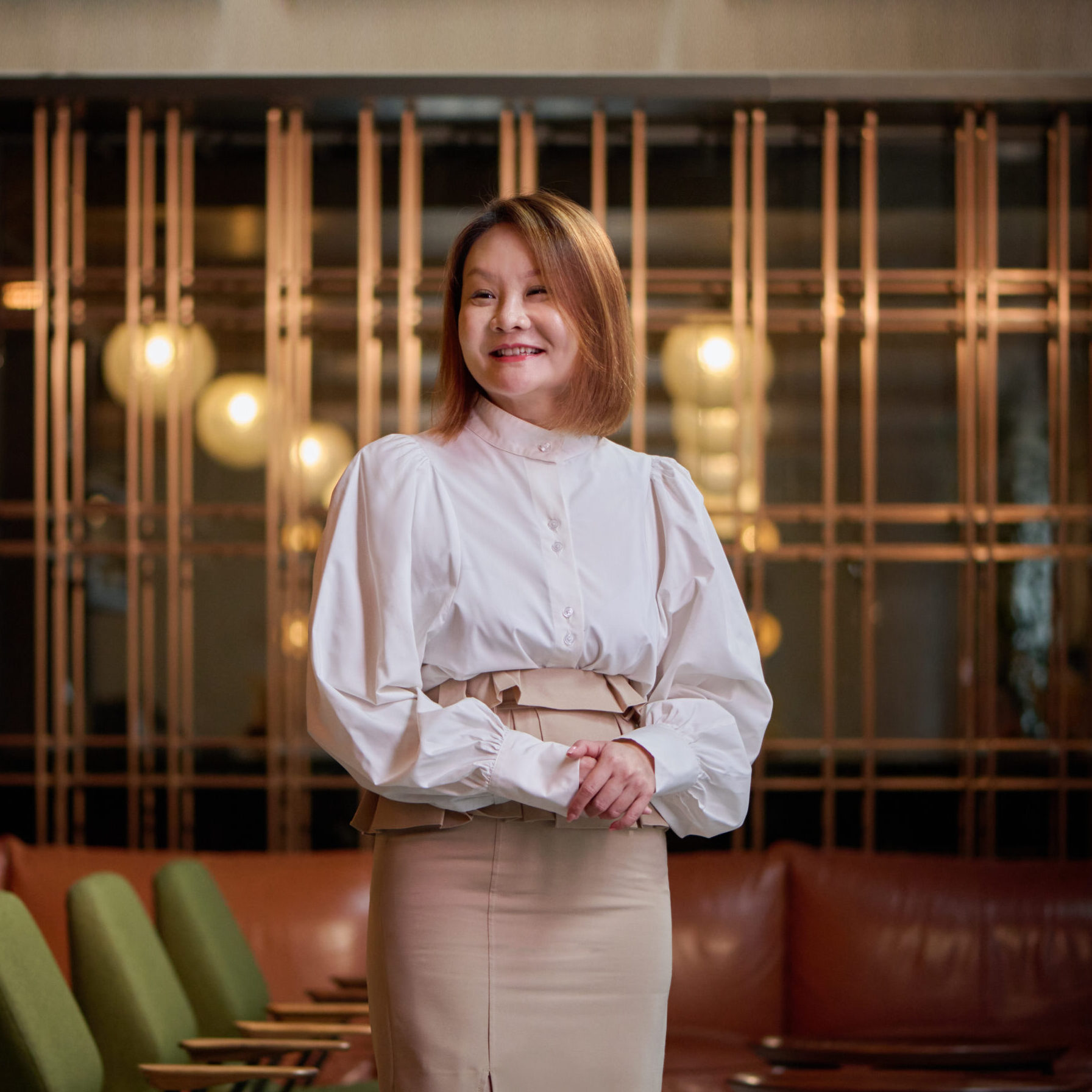 HIRES SHUE 059 woman with short hair wearing an elegant outfit while smiling to the side