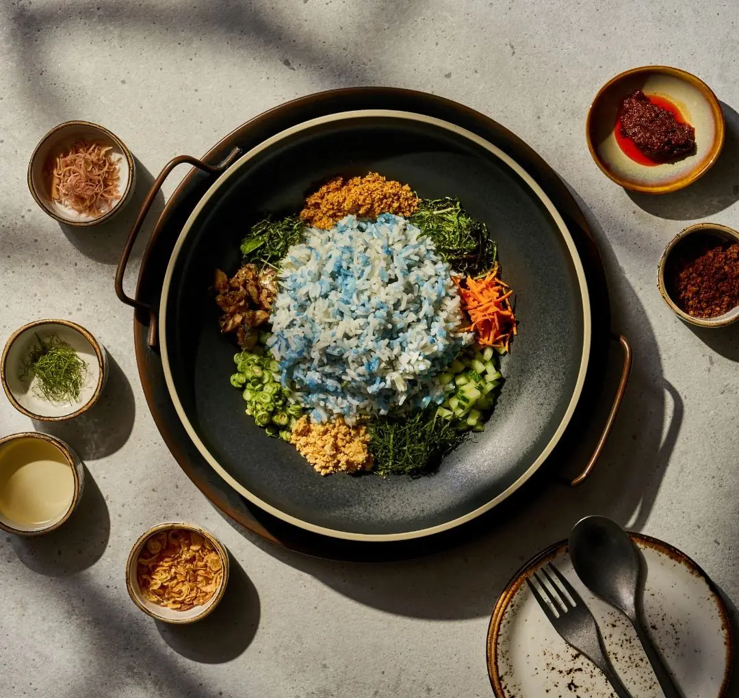 Nasi Ulam peranakan food. nasi ulam, delicious blue pea rice with herbs